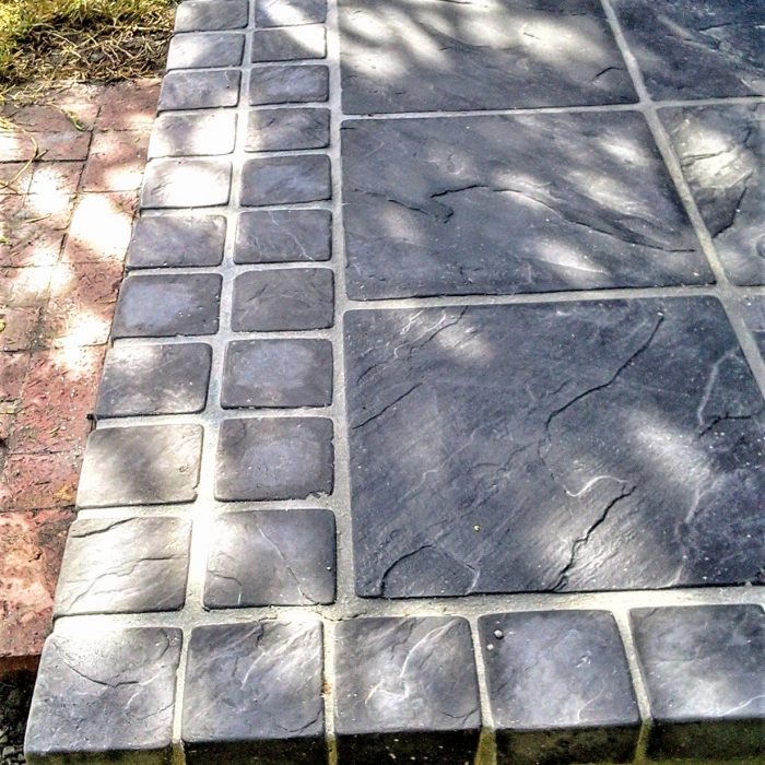 CHARCOAL SLABS WITH COBBLE BORDER