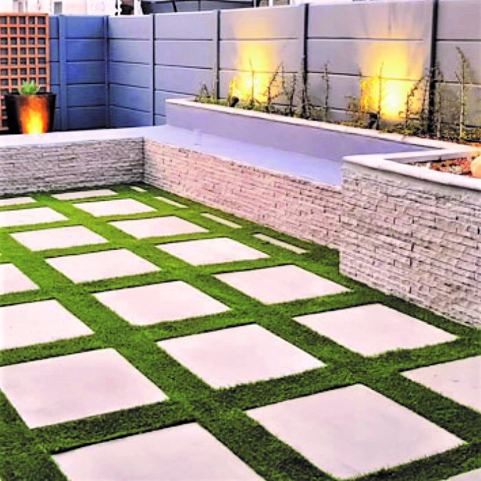 CLADDING WITH FLAGSTONE SLABS _ ARTIFICIAL GRASS INBETWEEN