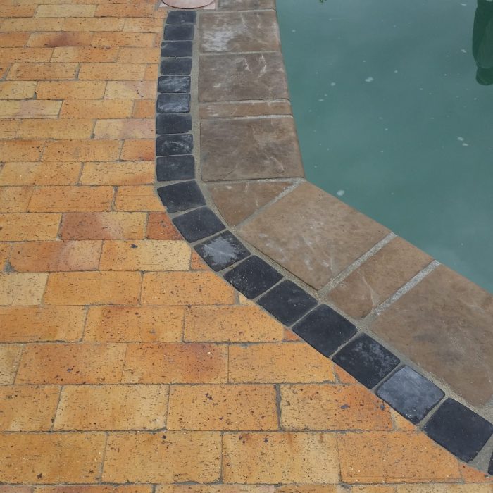 POOL COPING WITH CHARCOAL COBBLE BORDER